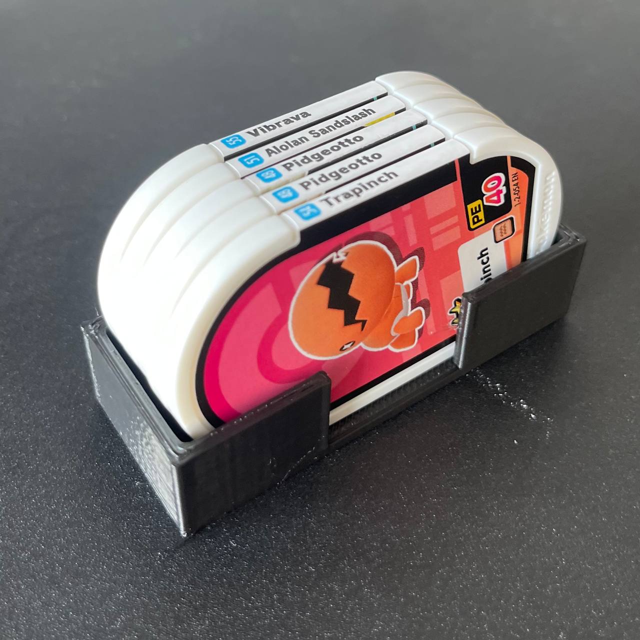 Finished 3D-printed holder with the Mezastar Pokémon tags